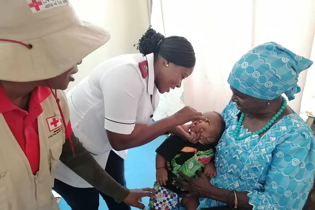 A nurse administering a dose of the oral polio vaccine to a minor at the Indira Gandhi Health Clinic in the Omusati region of northern Namibia. Credit: Namibia Ministry of Health and Social Services