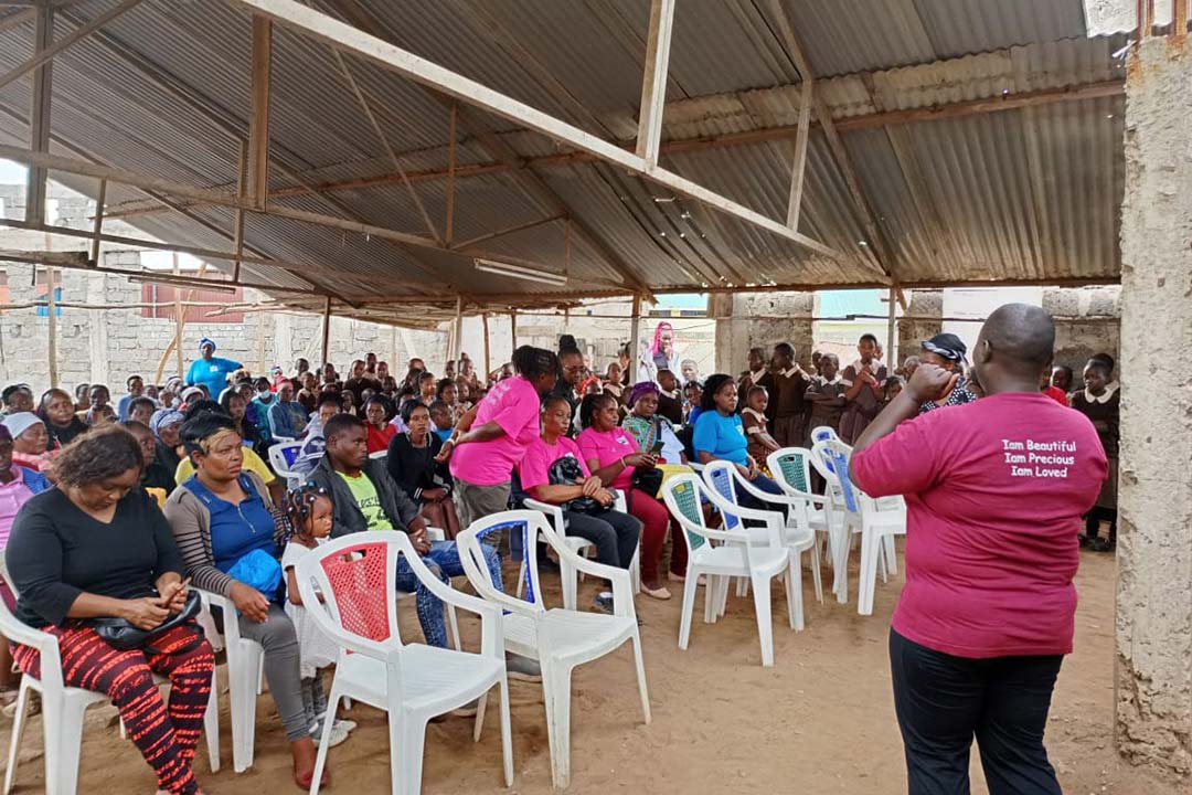 A cervical cancer survivor addresses girls and women at Kariobangi Primary and Nursery School in Nairobi. Credit: Victoria Amunga