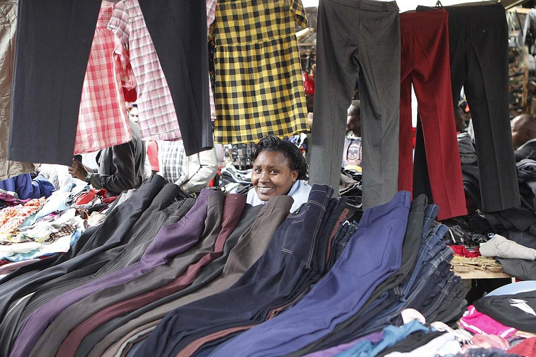 A woman displays her wares for sale at a market in Nairobi. Image by Biva2017 via Wikimedia Commons (CC BY-SA 4.0).