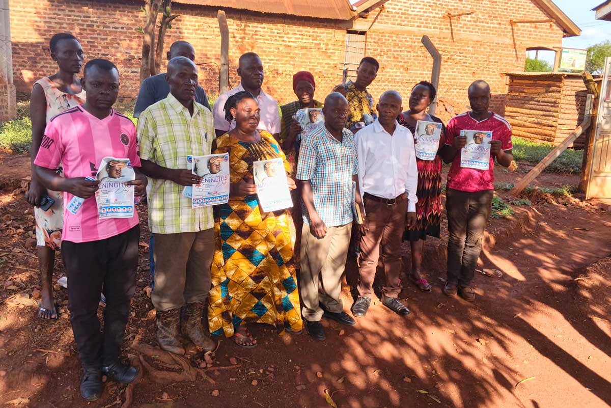 Community members from Kagoma south ward pose for a photo after an awareness campaign against meningitis in the area. Credit: Bountiful Missions Uganda