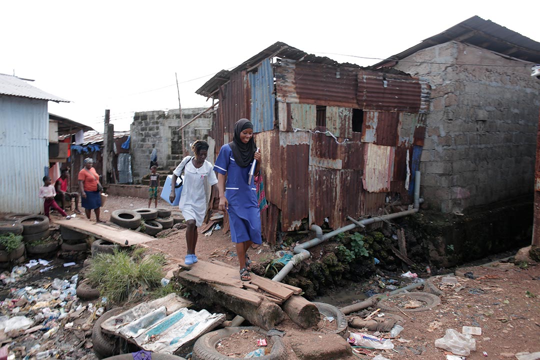 Health workers in one of Freetown's largest slums, Congo Town. Credit: Saidu Bah