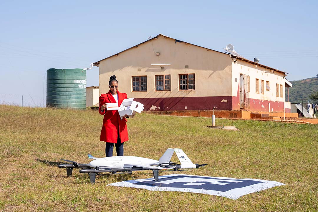 Health worker receives drone-delivered medications in Eswatini. Credit: Nkwe