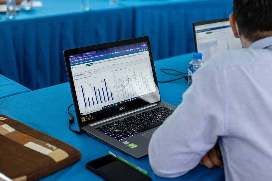 A DHIS2 user explores a dashboard during refresher training in May 2022. Credit: PSI Laos