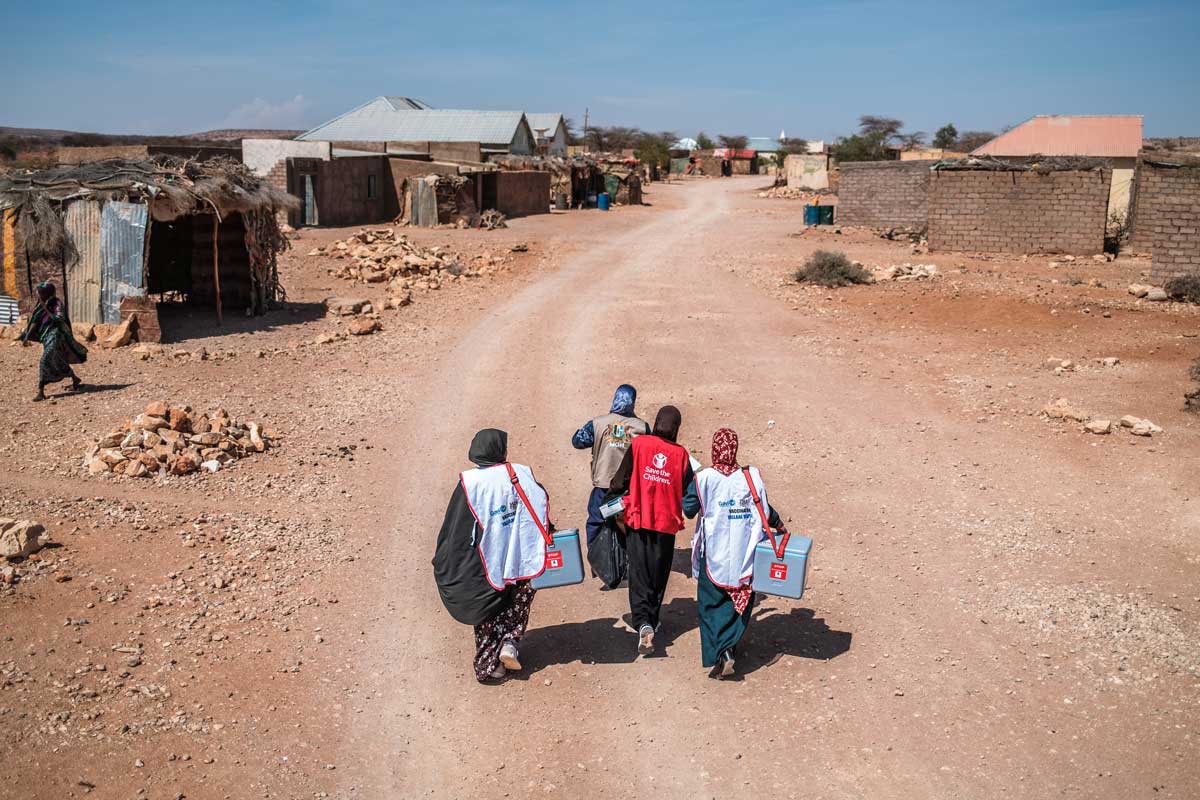 Health workers deliver vaccinations against diphtheria, pneumonia and measles to some of Somalia’s hardest-to-reach communities. The team travels up to 300 kilometres by ambulance, donkey and on foot, maintaining the cold chain throughout. Credit: Save the Children/2026/Brian Otieno