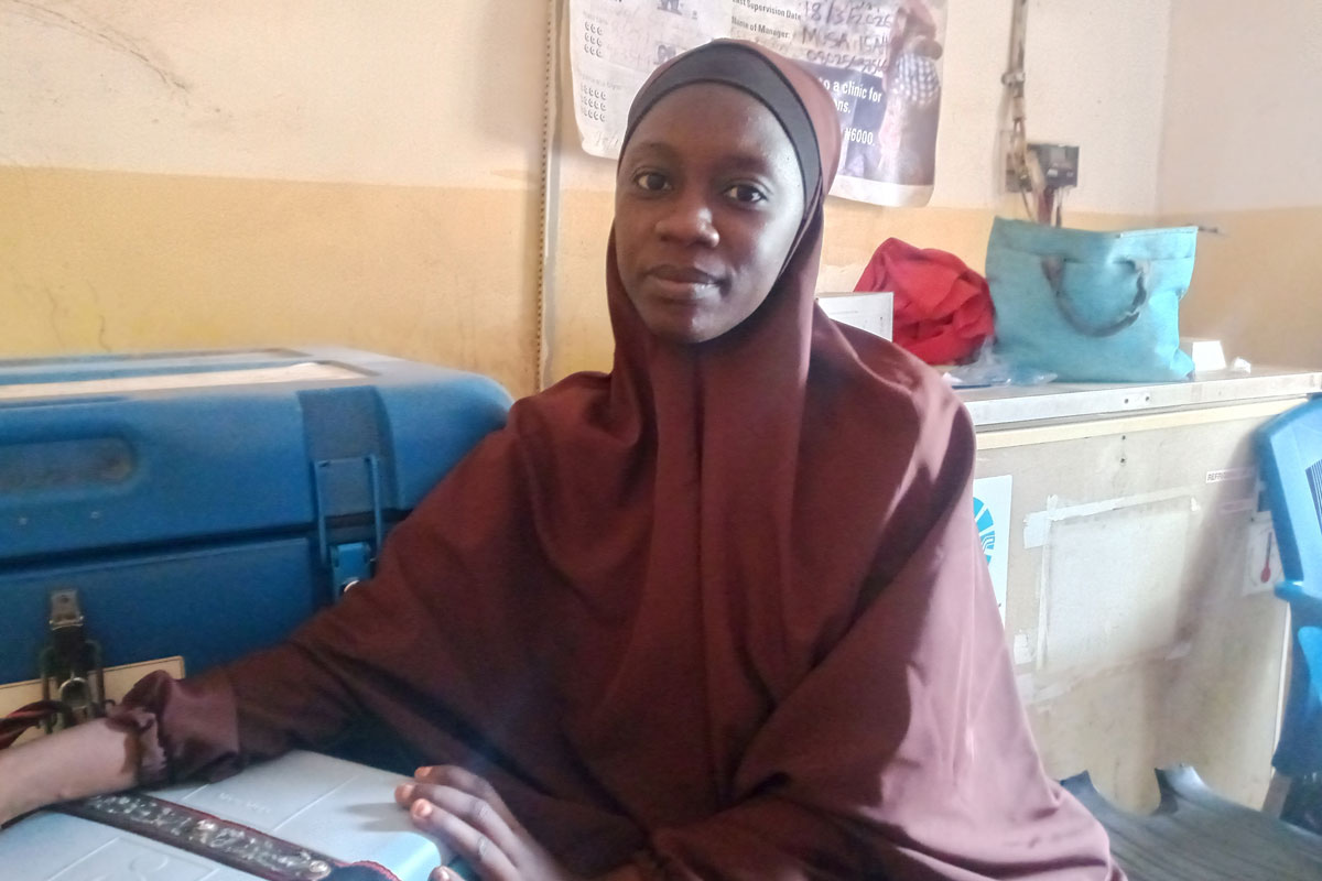 Aina’u Abubakar, a vaccinator and former polio supervisor, says tracking tools like tally sheets help ensure no child is missed during immunisation sessions. Credit: Jesusegun Alagbe