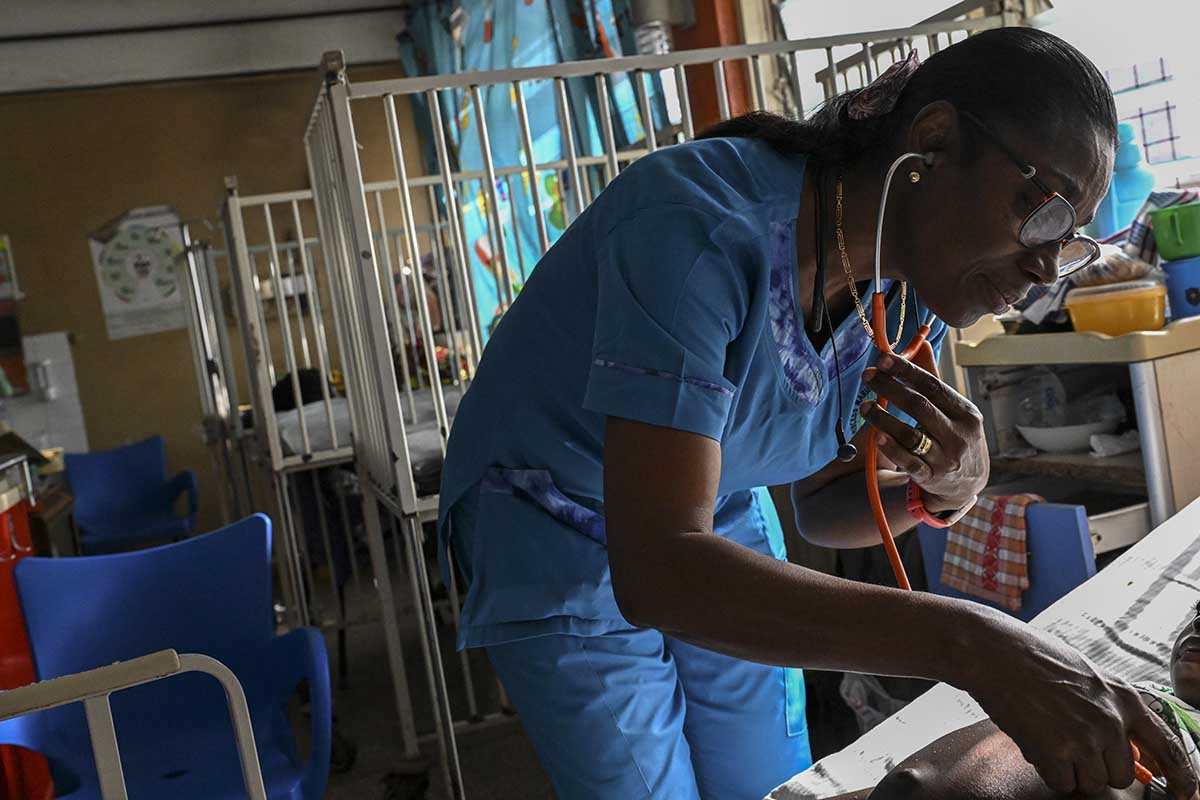 Dr. Mame Yaa Nyarko, director of the Accra Children's Hospital, examines a young patient.