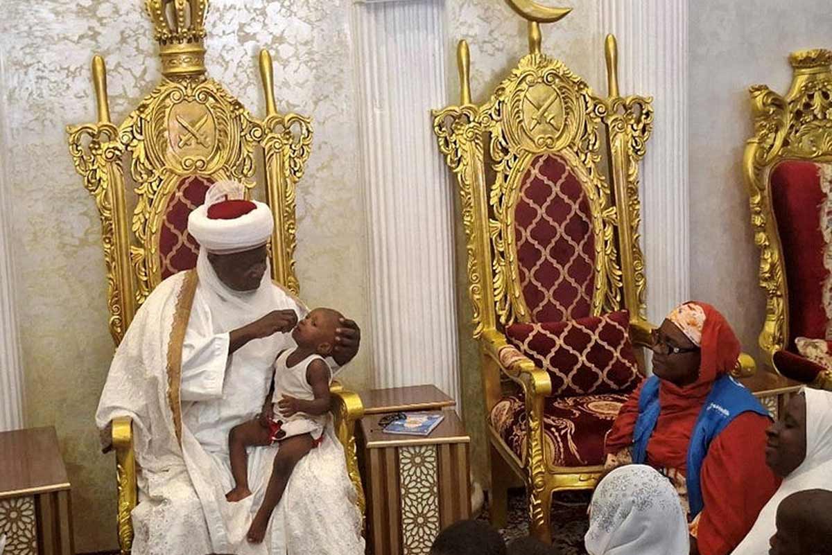 Emir Mera vaccinating one of his children during one of the routine immunisation in Kebbi State. Credit: UNICEF Nigeria