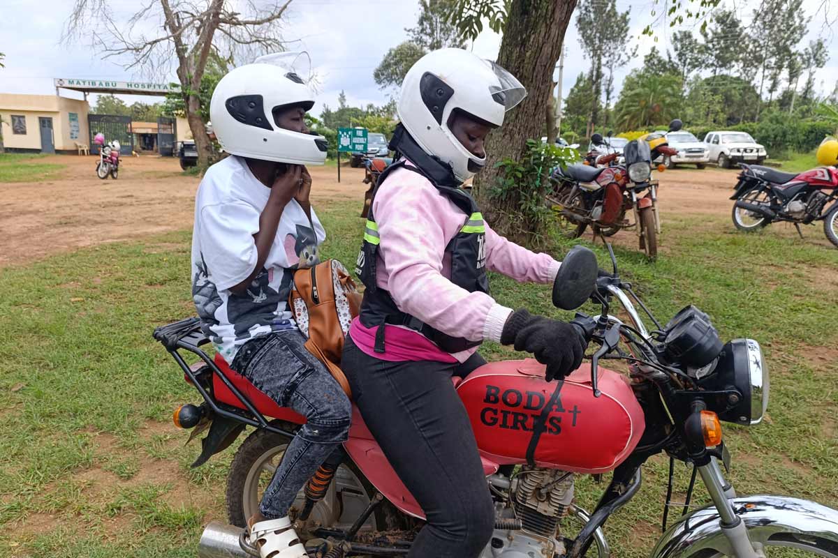 Jane William, female motorbike rider, with an ANC client Mercy Atieno. Credit: Angeline_Anyango.
