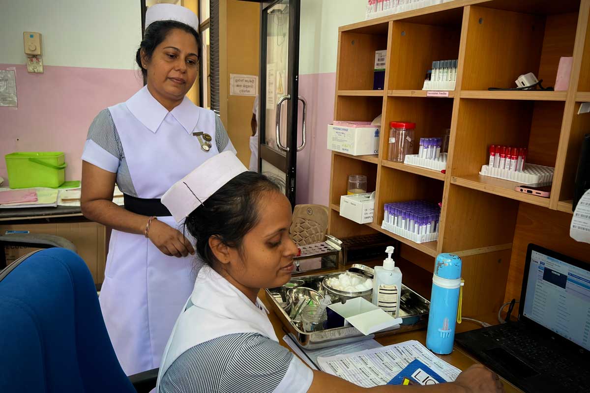 Nursing Officer-in-Charge Amali Nisansala supervises blood sample collection at the National STDAIDS Control Programme. Credit: Aanya Wipulasena
