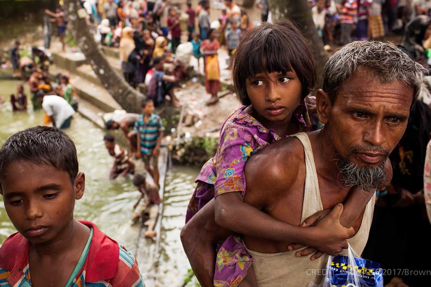 A father carrying his daugher