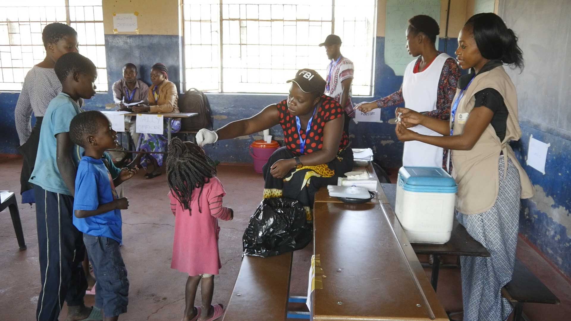 Child receiving an oral cholera vaccine dose