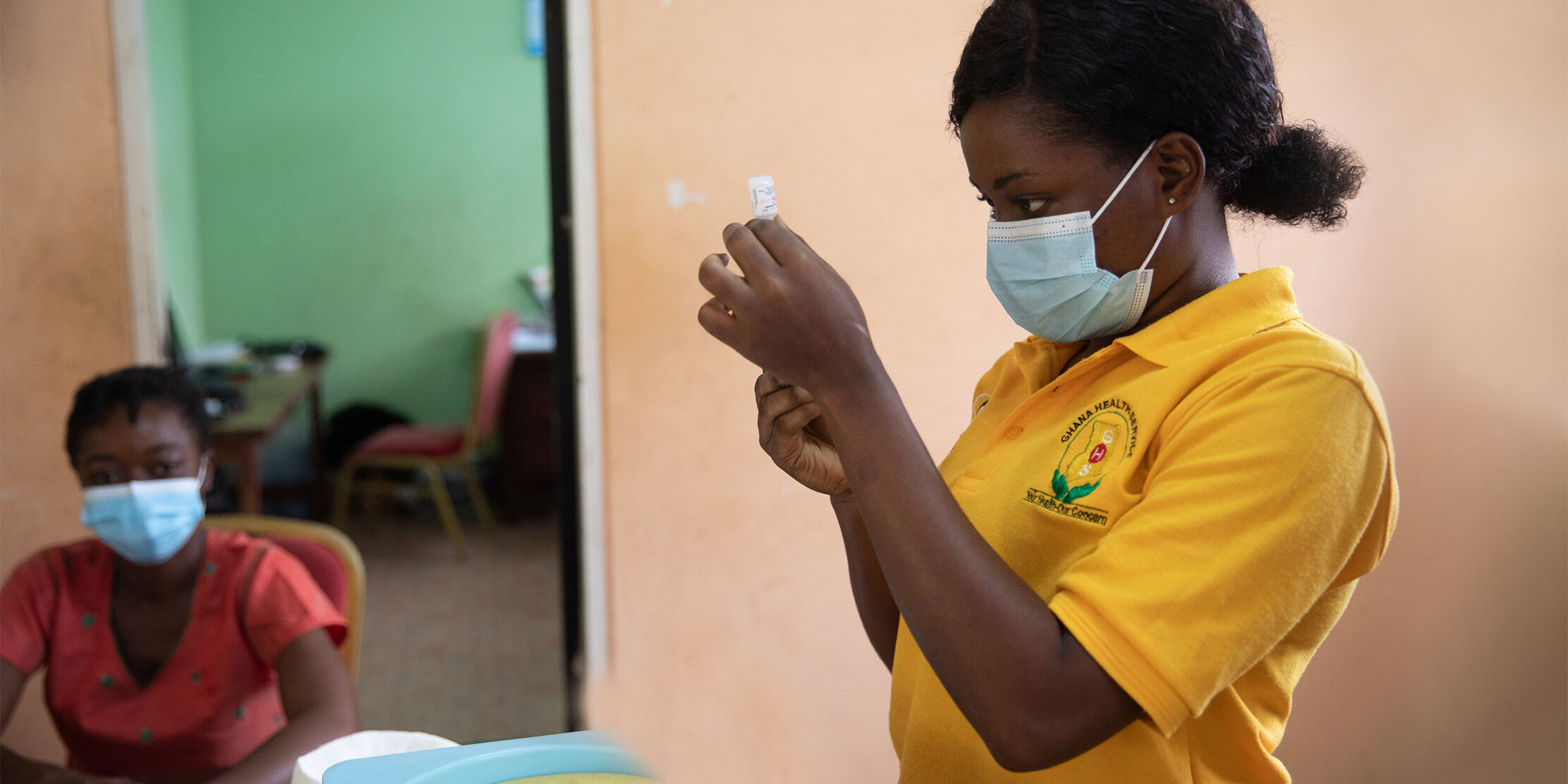 A health worker prepares to vaccinate a student in Adukrom in the Eastern Region, Ghana, on April 27, 2022. Ghana pushes towards community vaccination to increase its vaccinated population. Credit: Gavi/2022/Nipah Dennis